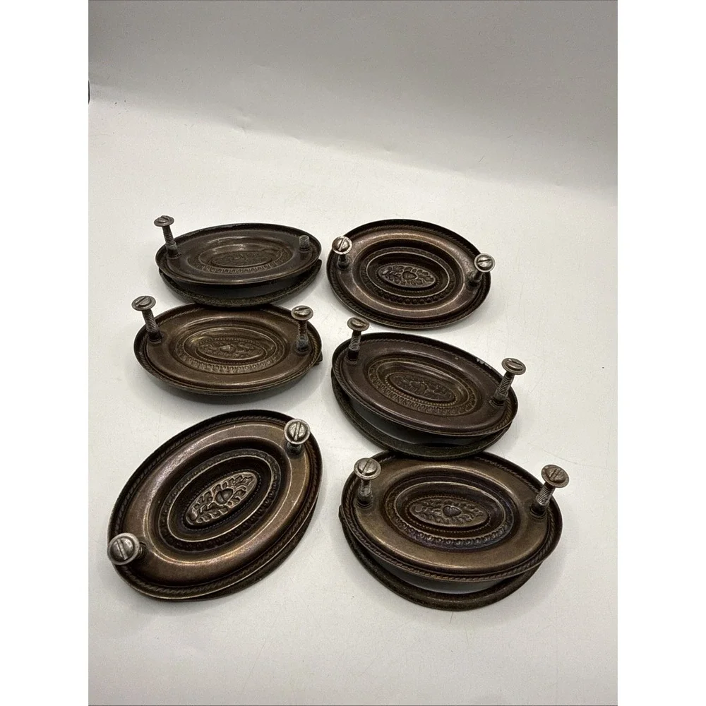 Antique Hepplewhite-style drawer pulls embossed oval backplate